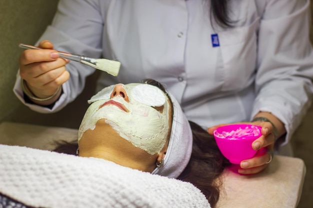 woman working in beauty salon young woman in spa salon