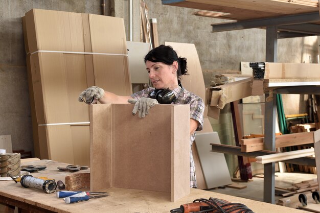 A woman working in a carpentry workshop