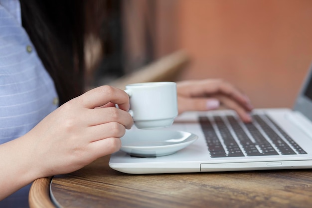 Woman working computer and coffee