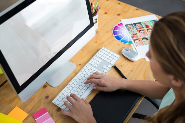 Woman working on desktop pc