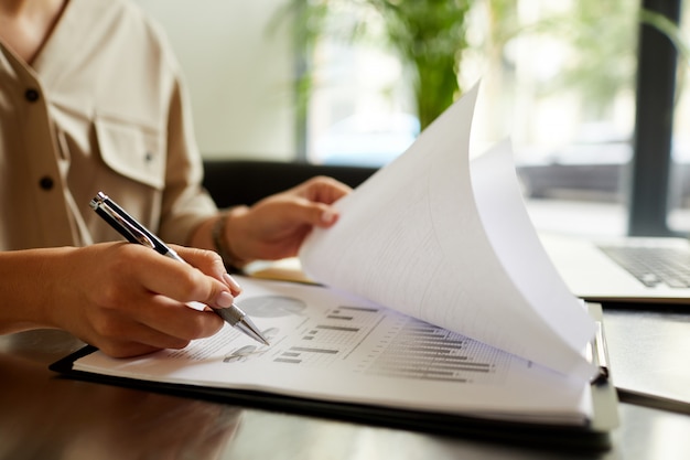 Woman working over financial reporting