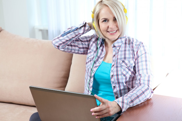 Woman working on her laptop at home