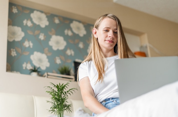Woman working at home with laptop
