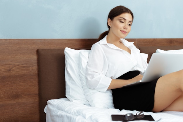 Woman working in hotel room