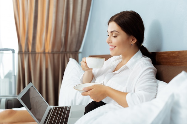 Woman working in hotel room