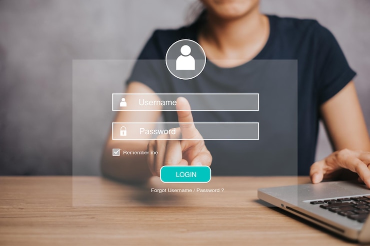 Photo woman working on laptop computer with login and password on screen display cyber security concept data protection and secured internet access