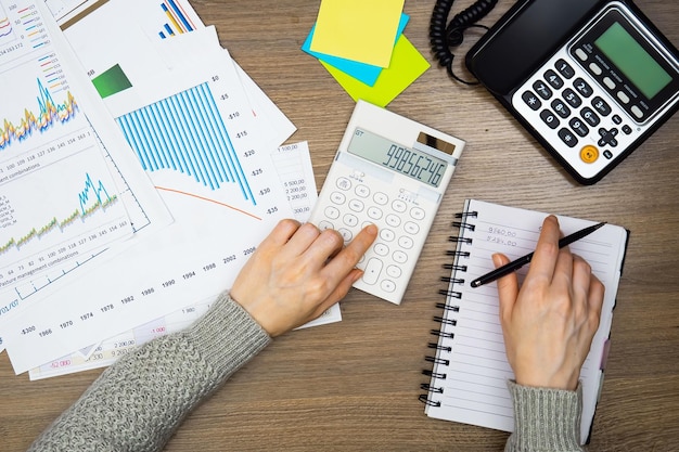 Woman working on laptop at home office Business and finance concept