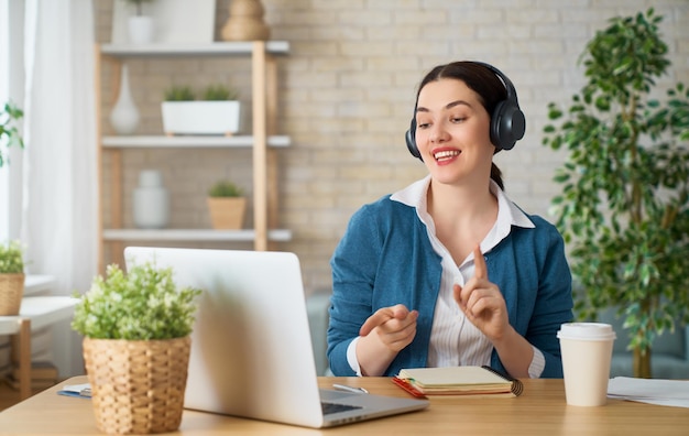 Woman working on a laptop at home.