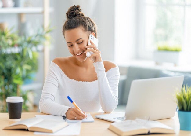 Woman working on laptop at home