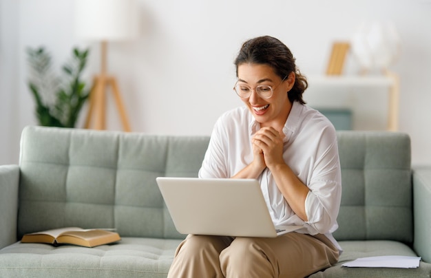 Woman working on laptop at home