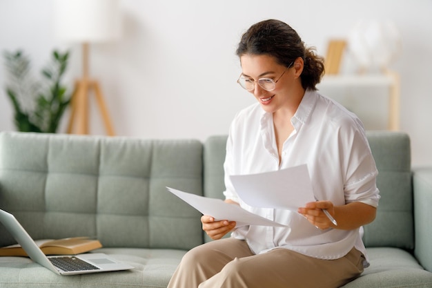 Woman working on laptop at home