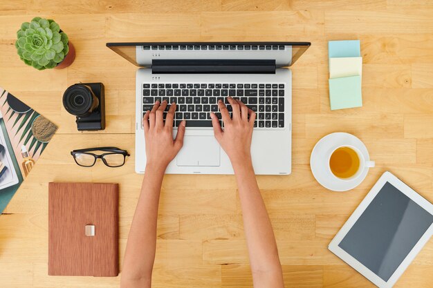 Woman working on laptop at office