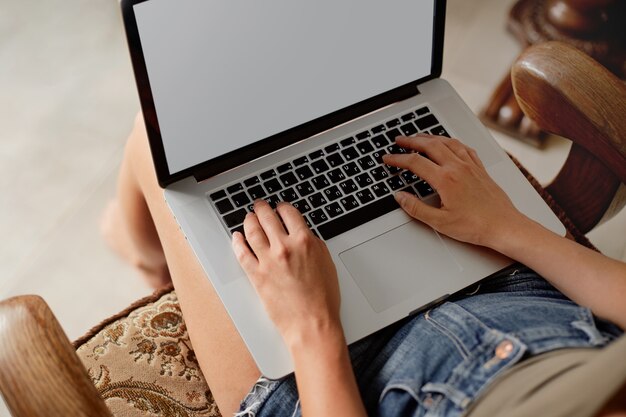 Woman working on a laptop. Workspace with laptop. Distance learning