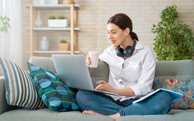 Woman working on a laptop.