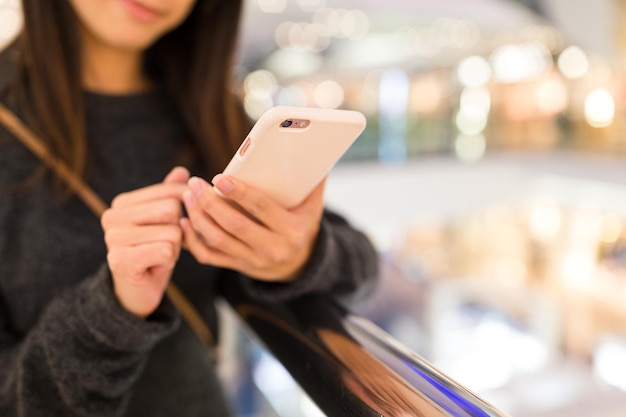 Woman working on mobile phone