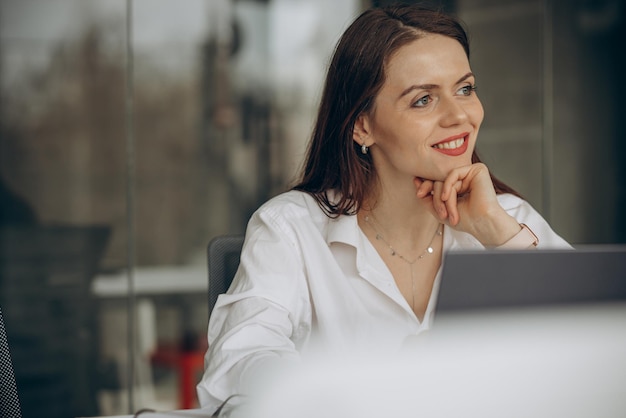 Woman working in office on a computer