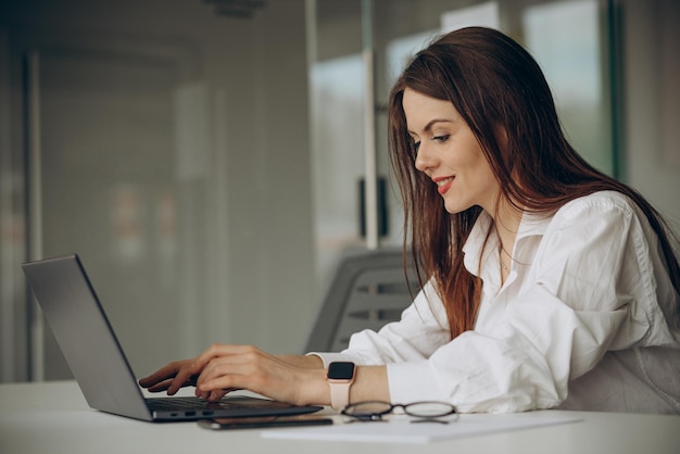 Woman working in office on a computer