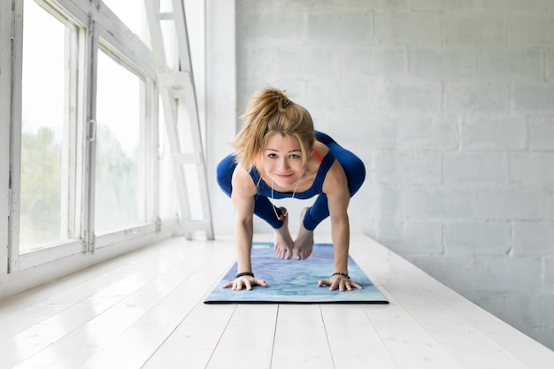 Woman working out, doing yoga or pilates exercise and pose.