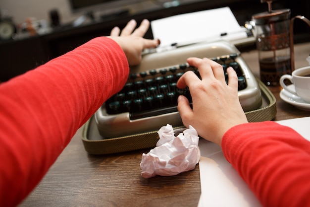 Woman working on typewriter