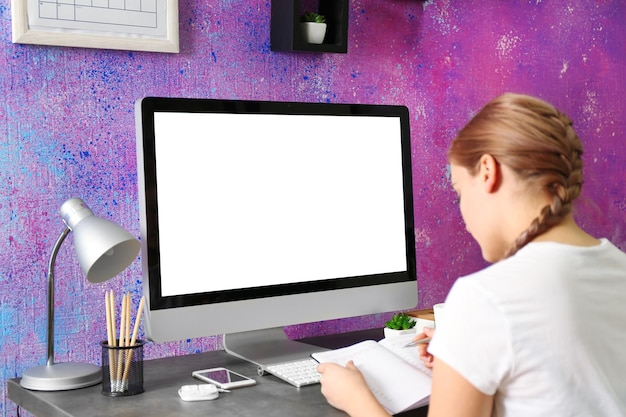 Woman working with computer at home