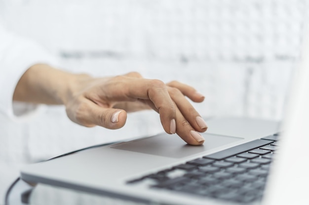 Woman working with laptop business and technology concept Close up