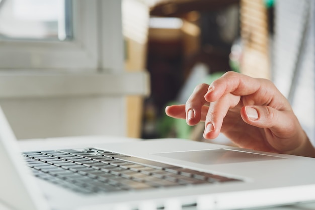 woman working with laptop placed on the black desk