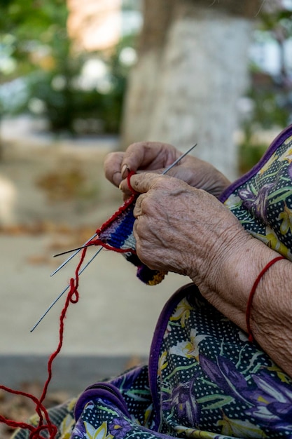 A woman working with a sewing pin