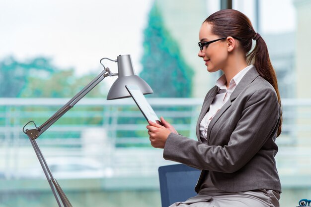 Woman working with tablet in office