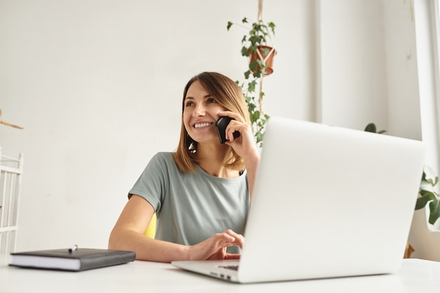 Woman works in a cozy home office