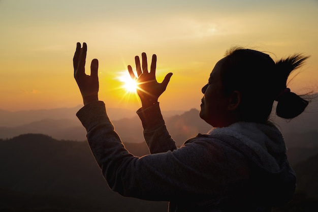 Woman worship on sunset