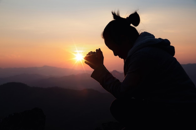 Woman worship on sunset