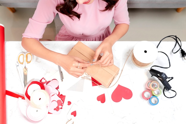 Woman wrapping Christmas gifts