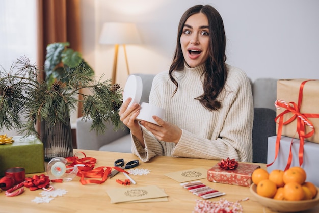 Woman wrapping Christmas Presents Gifts