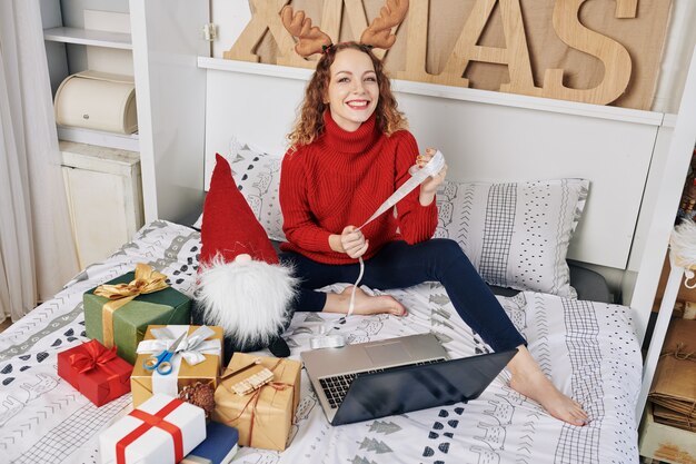 Woman wrapping New Year presents