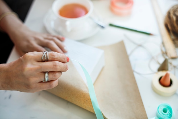 Woman wrapping a present