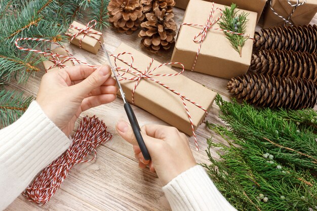 Woman wrapping presents for Christmas. 