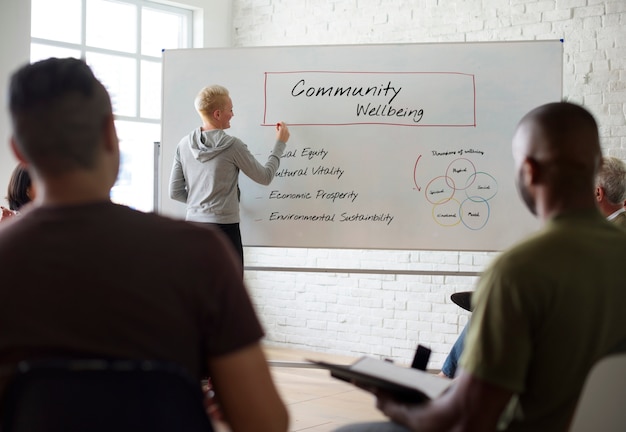 Woman writing on board in seminar