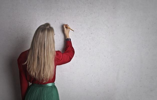 Woman writing on a board