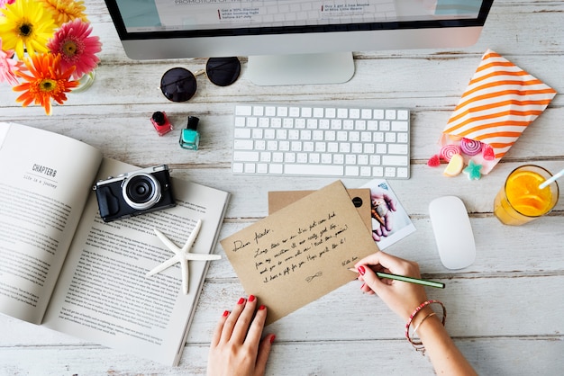 Woman writing a postcard