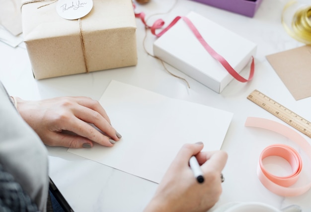 Woman writing a wishing card