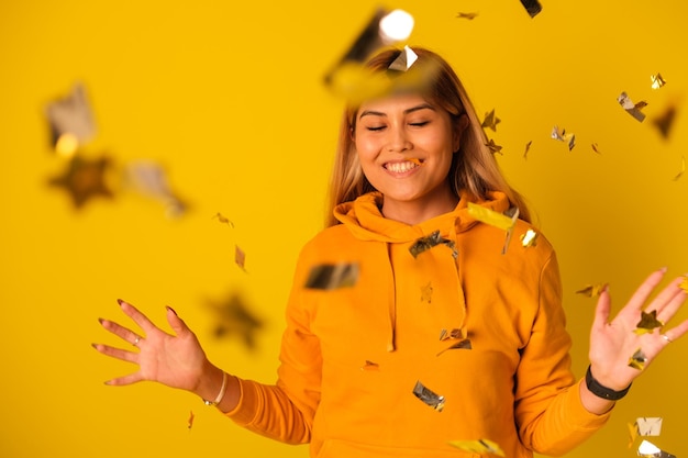 A woman in yellow clothes rejoices in a holiday