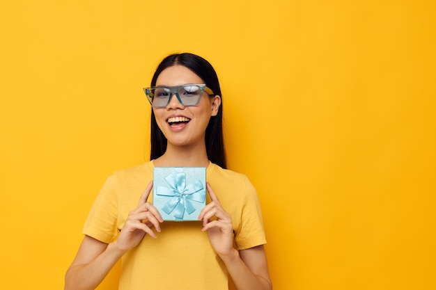 Woman yellow tshirts birthday gift box isolated background unaltered