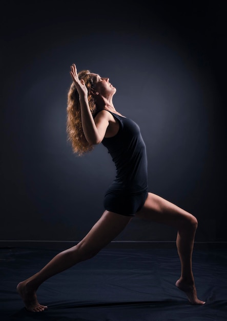 Woman in yoga pose in a studio shot