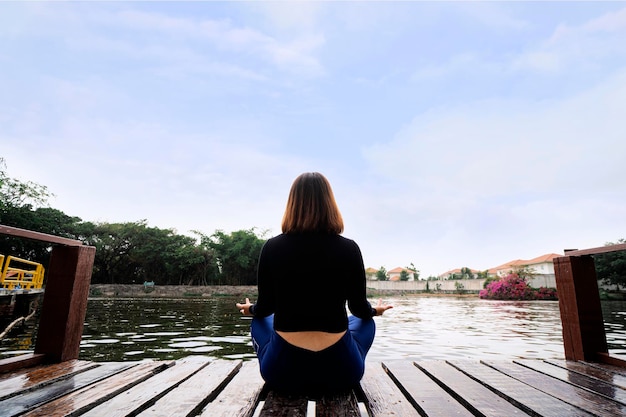 Woman do yoga relax outdoor Woman exercising pose vital and meditation