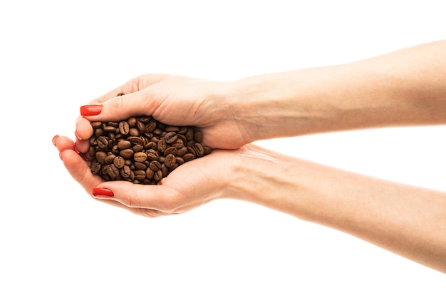 Woman39s hands with red nails holding coffee beans