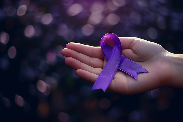 Photo womans hand holding purple ribbon