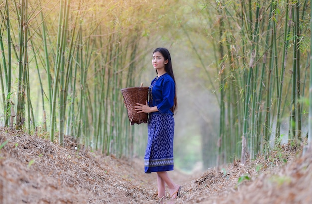 Women asia farmer in bamboo forest nature young woman smile Life dress tribe