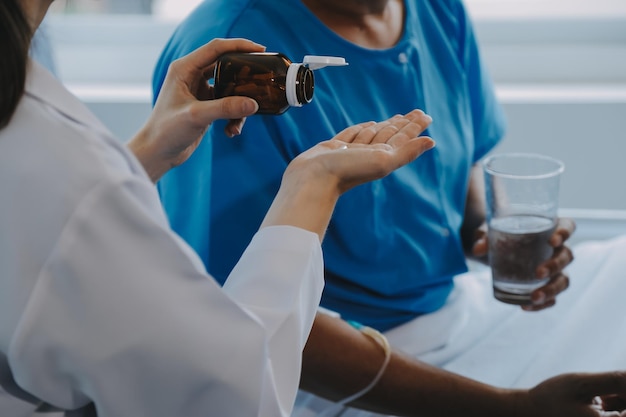 Women Asian doctors hold the patient hand and encourage and provide medical advice While checking the patient health in bed Concept of Care and compassion antenatal care Threatened abortion