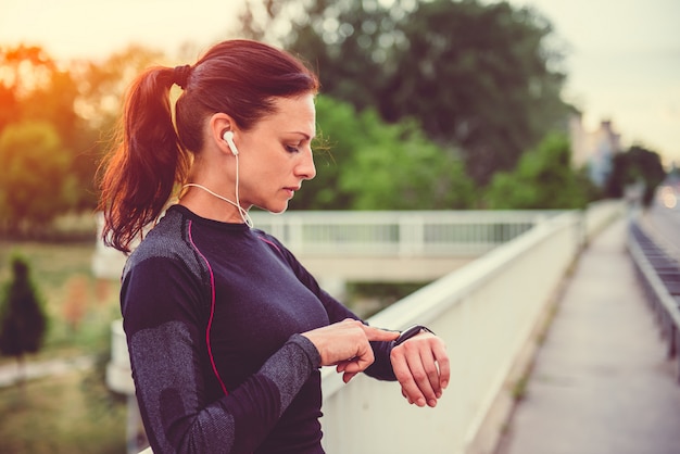 Women checking fitness tracker