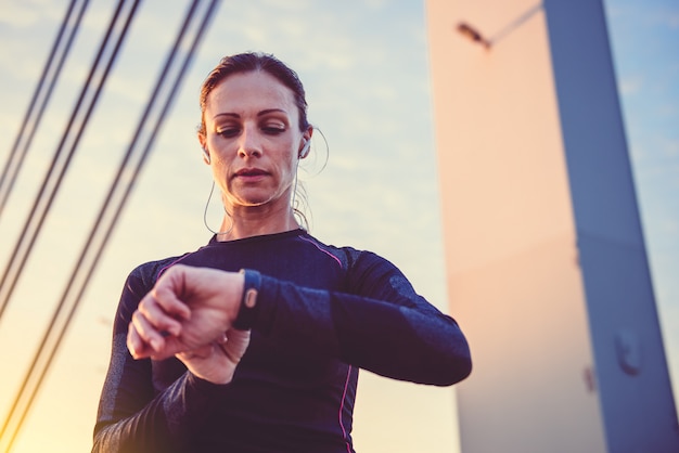 Women checking fitness tracker